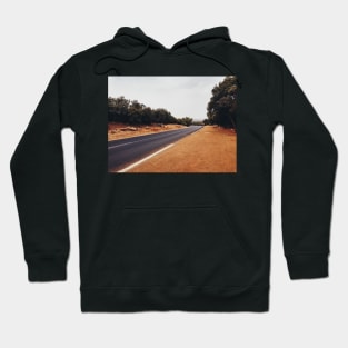 Man Walking Along Empty Road Hoodie